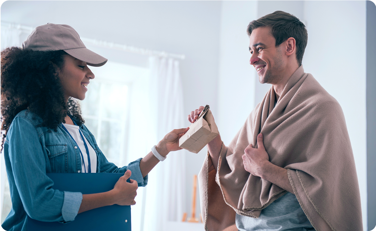 A customer opening their free delivery refill in their home.